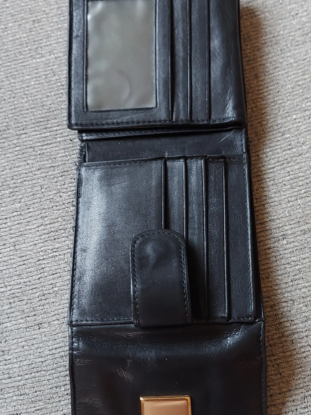 Tignanello Black Leather Bi-Fold Wallet with Gold Plaque